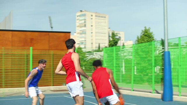 Basketball players competing during an outdoor match game