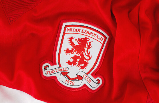 Kyiv, Ukraine. June 1, 2026. Close-up of the Middlesbrough Football Club embroidered crest on a red sports jersey fabric texture.