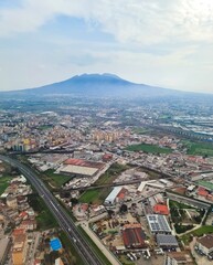 Obraz premium Mount Vesuvius towering over metropolitan Naples aircraft view