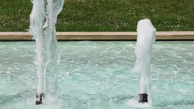 Super slow motion video of fountain water splashing