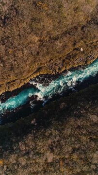 Epic Waterfall in scenic iceland nature, aerial shot - vertical video