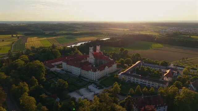 Top view of historic Kloster Roggenburg in southern Germany showing its baroque buildings, red roofs and green landscape, located in the Neu Ulm district within the cultural region of Oberschwaben