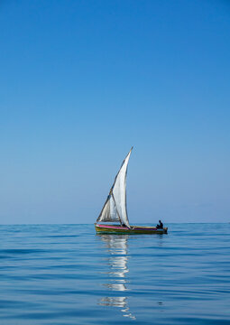 Dhow sailing on quiet sea, Nampula Province, Island of Mozambique, Mozambique