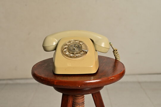an old telephone with rotary dial
