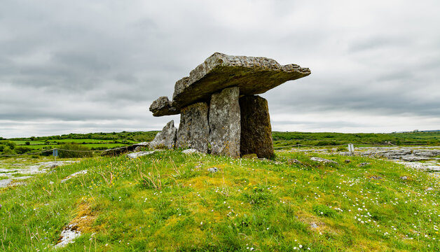 Ancient Poulnabrone Dolmen in the Burren, County Clare, Ireland. Neolithic portal tomb in the karst landscape of Burren National Park on the Wild Atlantic Way.