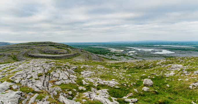 Limestone pavement landscape in Burren National Park, County Clare, Ireland. Wild karst scenery on the Wild Atlantic Way with views across the Irish countryside.