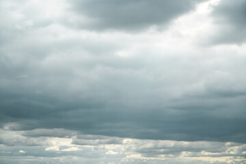 Obraz premium Dramatic storm clouds for the background. Isolated summer storm clouds before a thunderstorm. Dark storm clouds before the rain. Bad weather. A heavenly landscape of clouds in the sky on a rainy day.