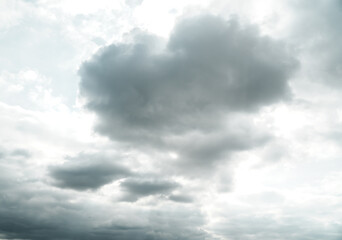 Obraz premium Dramatic storm clouds for the background. Isolated summer storm clouds before a thunderstorm. Dark storm clouds before the rain. Bad weather. A heavenly landscape of clouds in the sky on a rainy day.