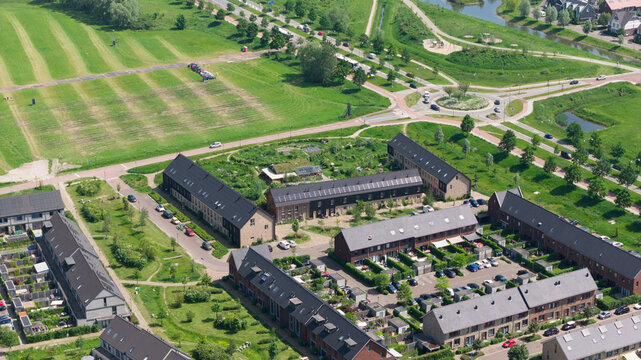 Aerial view of Ecodorp Zuiderveld featuring sustainable housing with solar panels, community gardens, and green urban planning in Nijmegen, Gelderland, Netherlands.