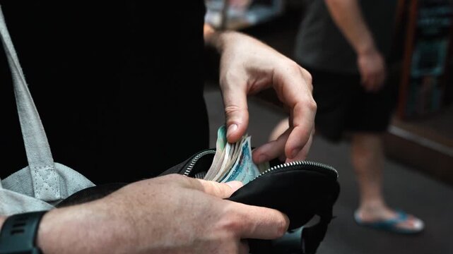 Vietnamese money search in black wallet