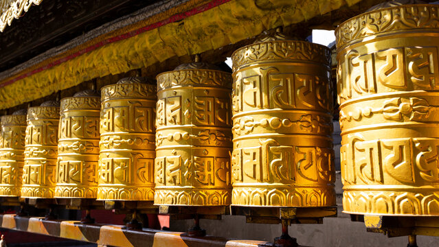Tibetan prayer wheels made from metal at Swayambhunath Temple - Monkey Temple, Kathmandu, Nepal