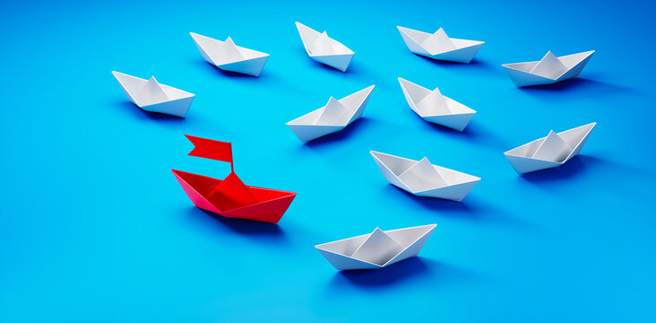 Group of  white paper boats with red leader in the middle on blue background - 3D illustration