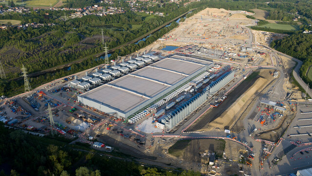 Aerial view of Charleroi SAM 3A industrial site with electrical infrastructure and construction works surrounded by greenery Farciennes, Region wallonne, Belgium.