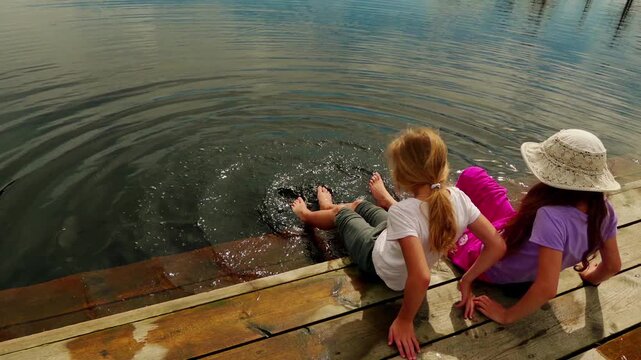 Two girls walk on Swamp Viru Raba in Estonia