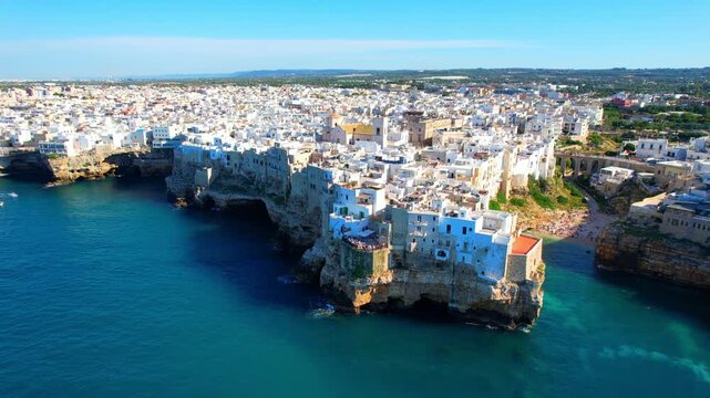 Polignano a Mare - Italy, Apulia - counterclockwise aerial view around the cliffs of the town