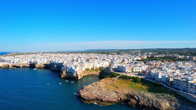 Polignano a Mare - Italy, Apulia - side-rotating aerial view at high altitude