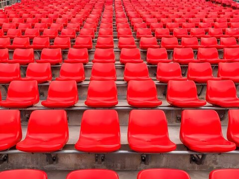 Rows of Red Plastic Stadium Seats in Sports Arena, Empty Football and Soccer Stadium Seating