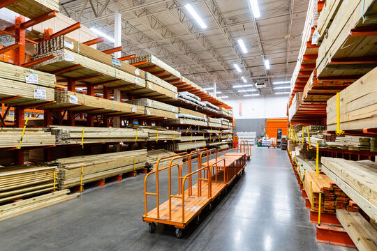 Lumber And Wood Building Materials On Shelving Displays Inside Contractor Home Improvement Warehouse Store