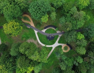 Abstract aerial top-down view of geometric walking paths in a green public park