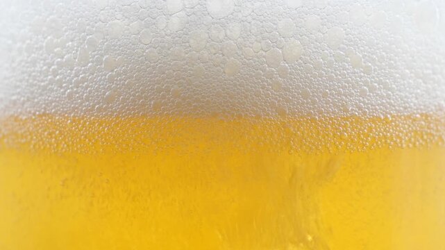 Beer in a glass. The drink is poured into the glass.