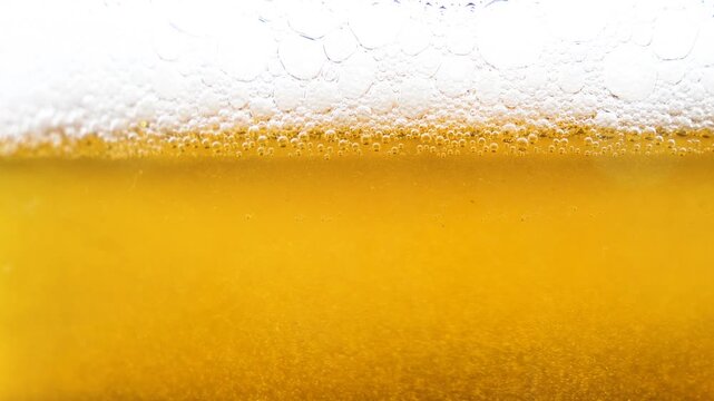 Beer in a glass. The drink is poured into the glass.