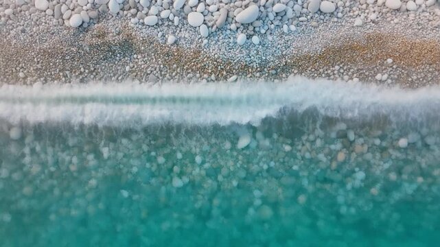 Aerial view of Calabria coastline drone shot of pebble beach