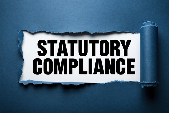 statutory compliance text written on white background under torn dark blue paper