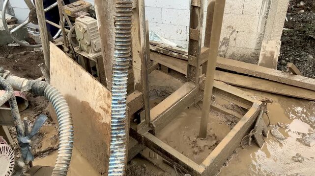 Portable water well drilling rig machine operating on a construction site