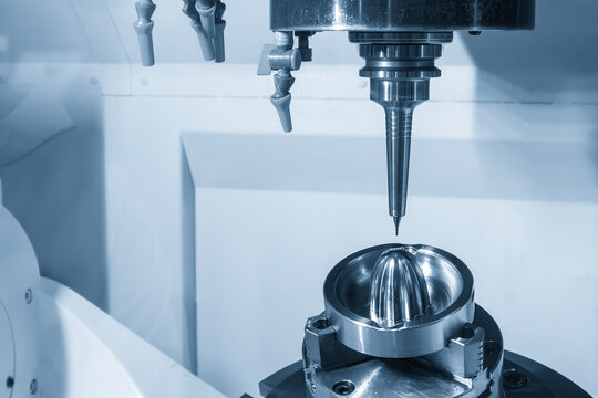 High-precision 5-axis CNC milling machine executing a finish cut on a mold part with a ball nose end mill tool in a blue tone.