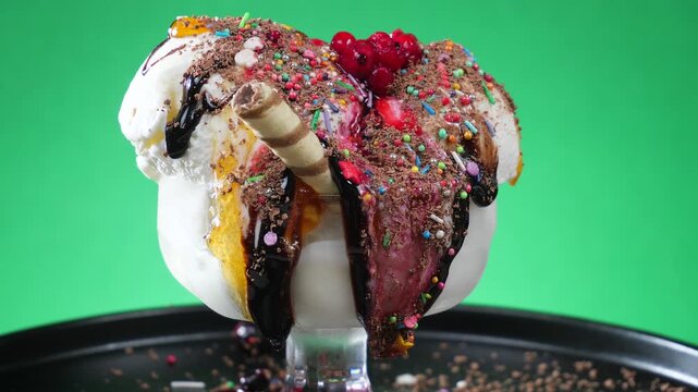 Ice cream in a glass slowly rotates around its axis and melts.