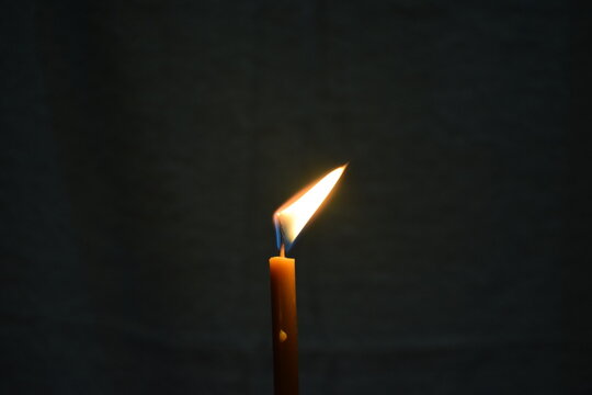 burning match on black background