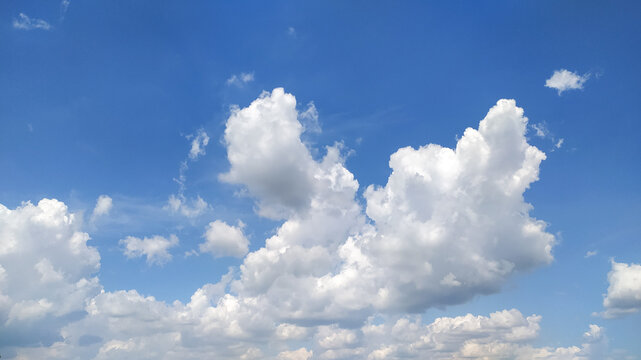 Blue sky with white clouds stock photo.