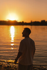 Fototapeta premium Peaceful Sunset Moment by Calm River