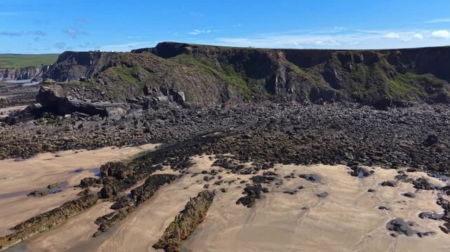 Golden sands revealed at low tide on Cornish beach