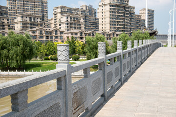 Jiangsu Waterfront Park with Modern Architecture and Stone Bridge © NgoVan
