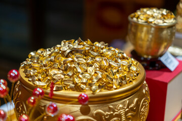 Piles of Traditional Chinese Gold Ingots and Golden Bowls © onlyyouqj