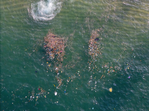 Aerial view of plastic waste and garbage floating on the surface of the ocean near Praia Vermelha, Rio de Janeiro, State of Rio de Janeiro, Brazil.