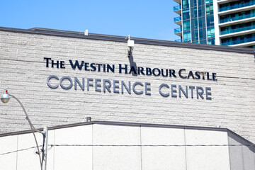 Naklejka premium Toronto, Ontario, Canada - June 19, 2018: The sign on the building for Westin Harbour Castle Conference Centre in Toronto, Ontario, Canada