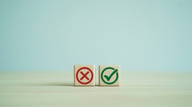 A minimalistic image of two wooden blocks with symbols on a table