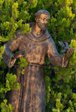 Statue of St. Francis of Assisi with a bird. Saint and Mystic of the Roman Catholic Church, Founder of the Franciscan Order.