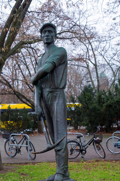 Broze statue of the Proletarian Hero on Alexanderplatz, Berlin, Germany