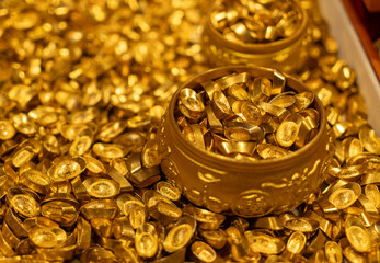 Piles of Traditional Chinese Gold Ingots and Golden Bowls © onlyyouqj