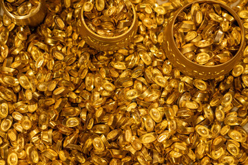 Piles of Traditional Chinese Gold Ingots and Golden Bowls © onlyyouqj