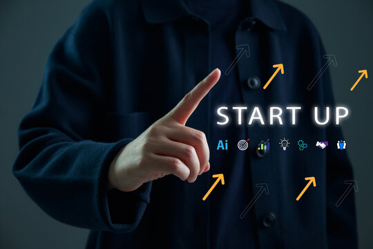 Startup business growth concept with hand pointing at digital interface and rising arrows, entrepreneurship, innovation, business strategy, goal achievement, and success in modern digital economy.