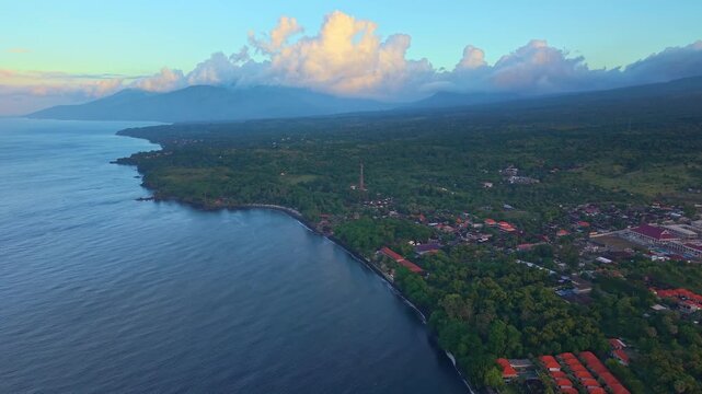 Aerial view of Tulamben coastline in Bali, Indonesia during a colorful sunset
