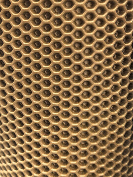 Honeycomb pattern rubber EVA mat texture closeup background in beige
