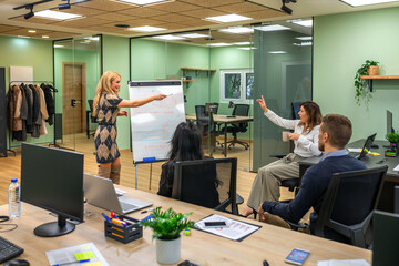 Naklejka premium Business professionals collaborating and discussing new strategies in office, analyzing data and charts on whiteboard in a meeting for company growth. Work team participating in brainstorming talk.
