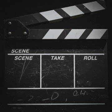 Classic Film Clapperboard on Black Background for Movie Production