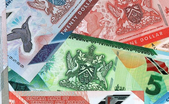 Trinidad and Tobago dollar money banknotes bunch on table. Trinidad and Tobago bills of TTD currency