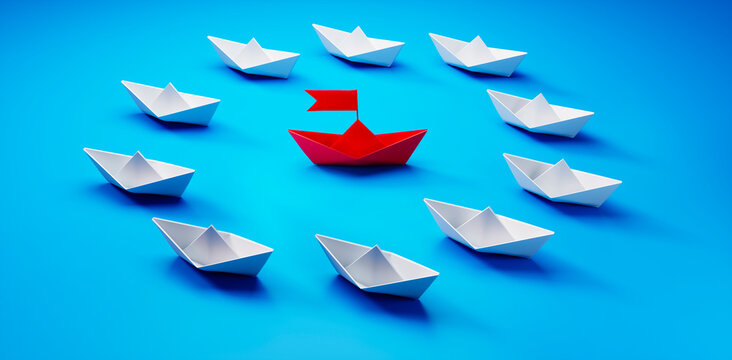 Group of  white paper boats with red leader in the middle on blue background - 3D illustration